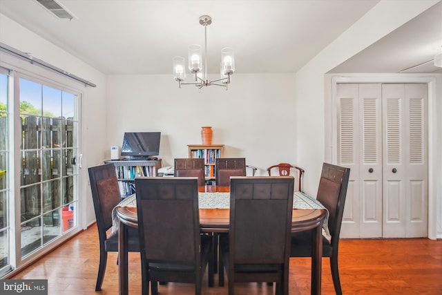 1650 Woodtree Ct E, Annapolis, MD 21409 - dining room featuring a chandelier and wood finished floors