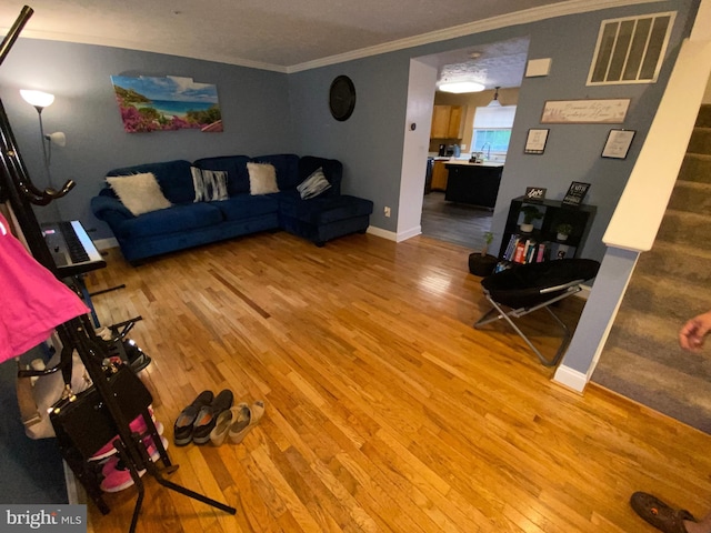 941 Chestnut Manor Ct, Curtis Bay, MD 21226 - living room with ornamental molding, light wood finished floors, and baseboards