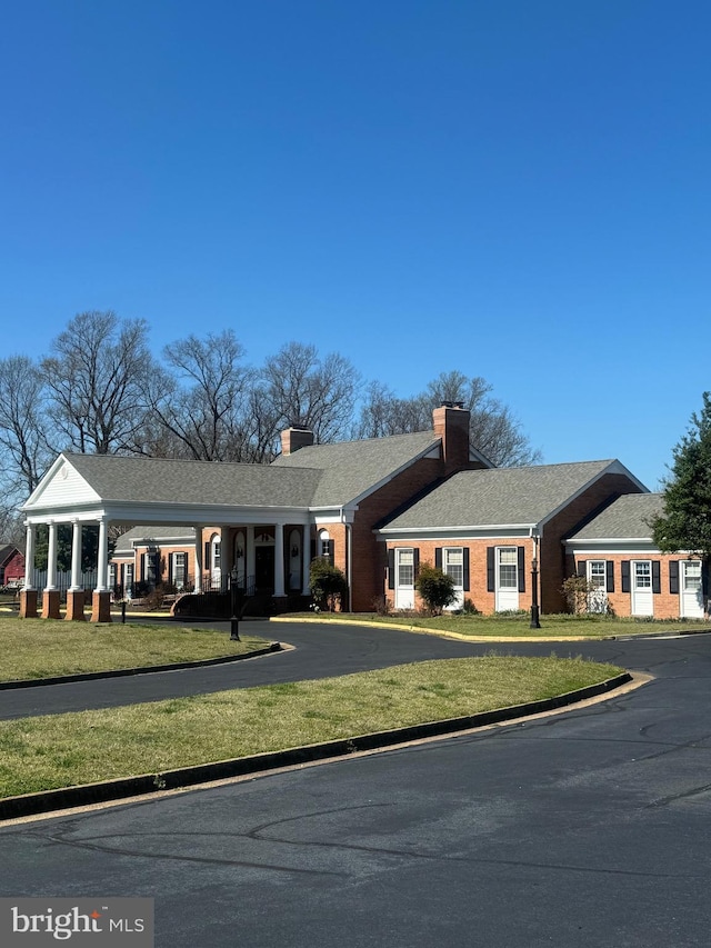 LOT58 Federalist Way, Montross, VA 22520 - ranch-style house with brick siding, a chimney, and a front yard