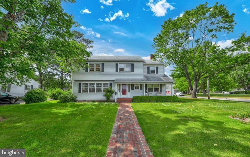 110 Ironshire St, Snow Hill, MD 21863 - view of front of home featuring a front yard and a chimney