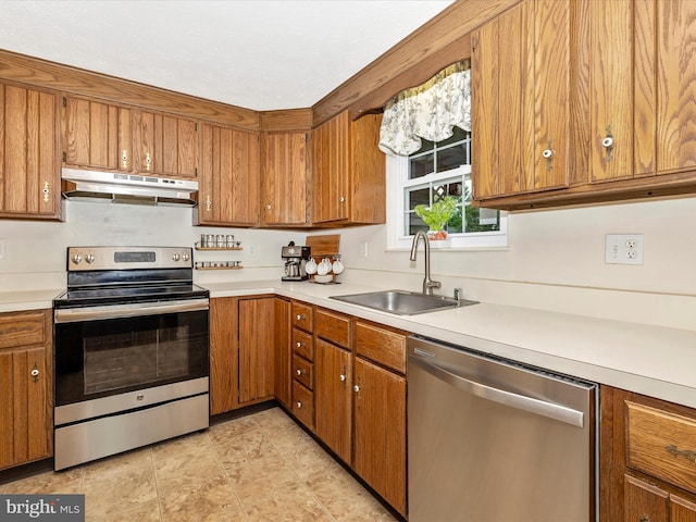 4310 Zircon Rd, Middletown, MD 21769 - kitchen with appliances with stainless steel finishes, under cabinet range hood, and brown cabinetry