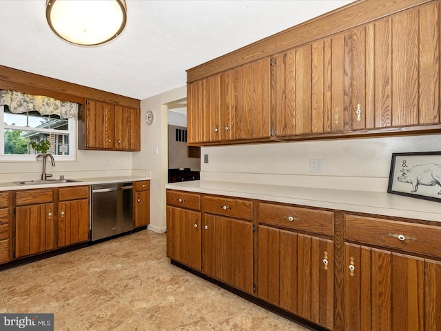 4310 Zircon Rd, Middletown, MD 21769 - kitchen with stainless steel dishwasher, a sink, brown cabinetry, and light countertops