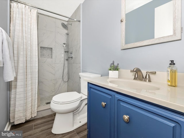 4310 Zircon Rd, Middletown, MD 21769 - full bathroom with toilet, vanity, tiled shower, and wood finished floors