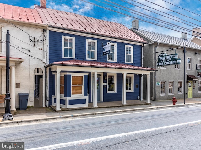 4310 Zircon Rd, Middletown, MD 21769 - view of front of property with a standing seam roof, a chimney, metal roof, and a porch