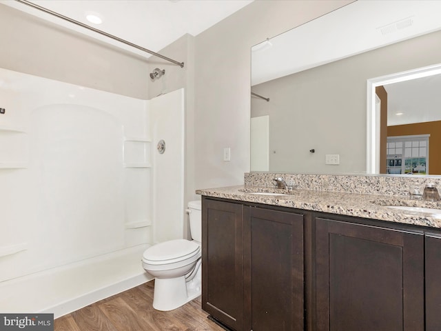 11044 Cross Fields Dr, Waynesboro, PA 17268 - full bathroom featuring wood finished floors, double vanity, and a shower