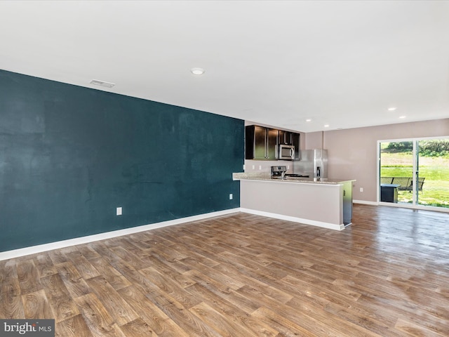 11044 Cross Fields Dr, Waynesboro, PA 17268 - unfurnished living room featuring wood finished floors and recessed lighting