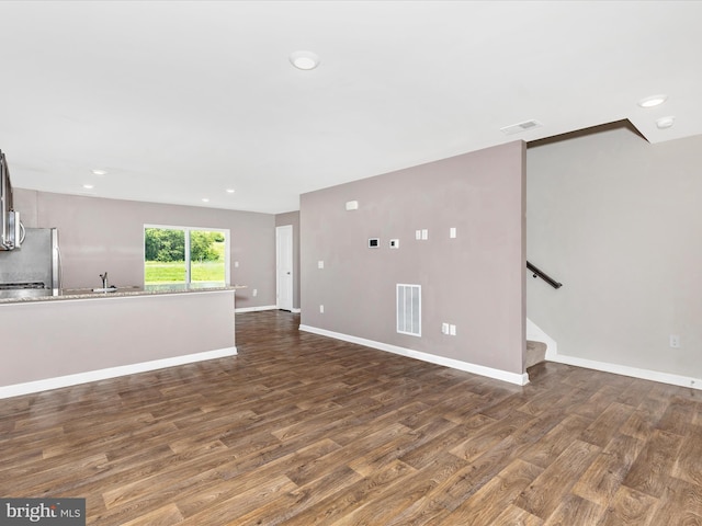 11044 Cross Fields Dr, Waynesboro, PA 17268 - unfurnished living room featuring dark wood finished floors, stairway, and recessed lighting