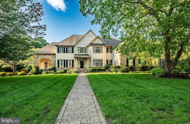 201 Ivystone Dr, Downingtown, PA 19335 - colonial house with stone siding, a front lawn, and stucco siding