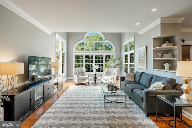 201 Ivystone Dr, Downingtown, PA 19335 - living room featuring crown molding, recessed lighting, wood finished floors, and baseboards