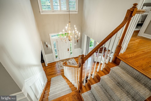 201 Ivystone Dr, Downingtown, PA 19335 - foyer featuring healthy amount of natural light, stairway, a high ceiling, a chandelier, and wood finished floors