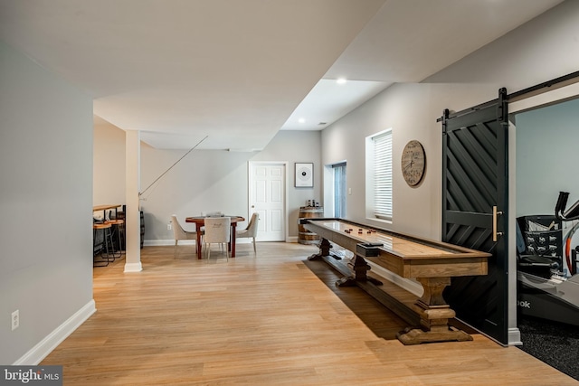 201 Ivystone Dr, Downingtown, PA 19335 - rec room with light wood-type flooring, baseboards, recessed lighting, and a barn door