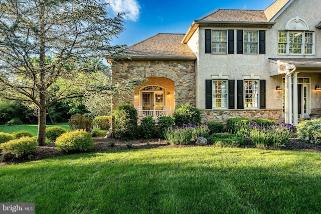 201 Ivystone Dr, Downingtown, PA 19335 - view of front of home with stone siding, a front lawn, and stucco siding