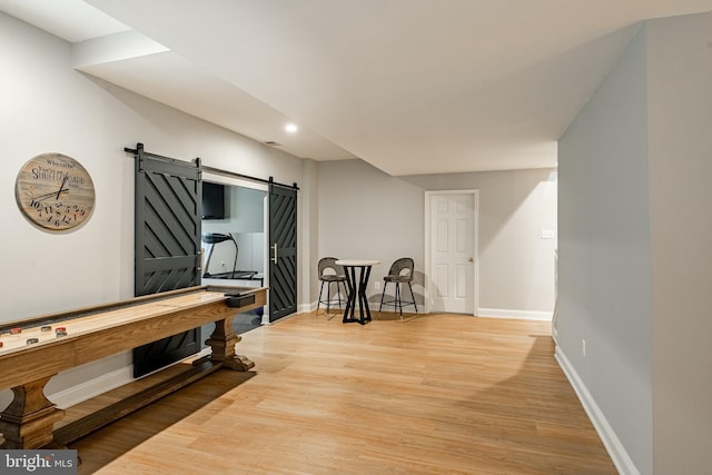 201 Ivystone Dr, Downingtown, PA 19335 - rec room featuring a barn door, light wood finished floors, baseboards, and recessed lighting