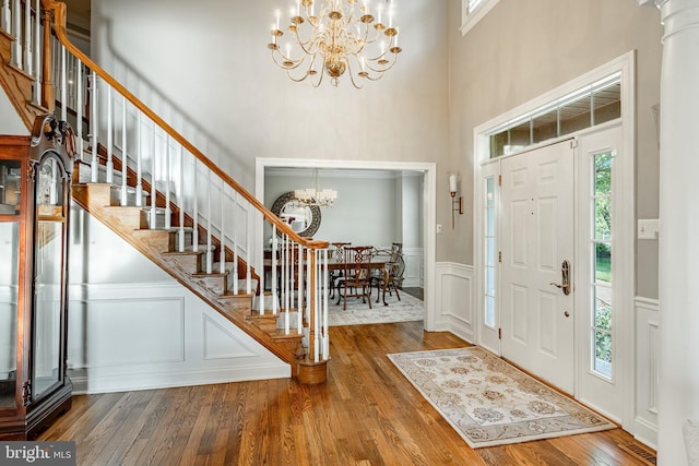 201 Ivystone Dr, Downingtown, PA 19335 - entrance foyer featuring a chandelier, stairs, a towering ceiling, hardwood / wood-style floors, and a decorative wall