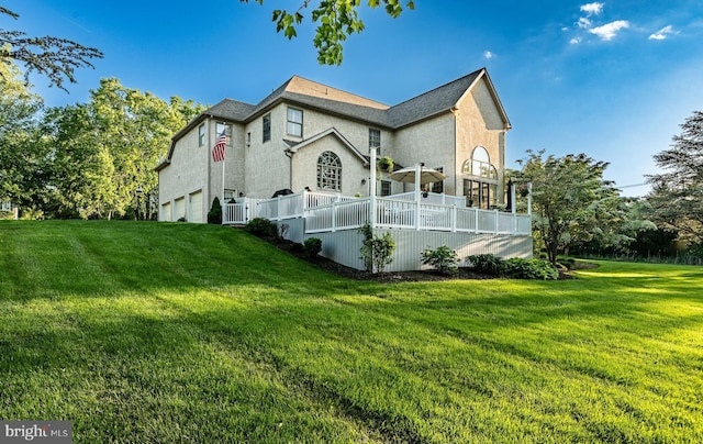 201 Ivystone Dr, Downingtown, PA 19335 - view of front of home with an attached garage, a front lawn, and stucco siding