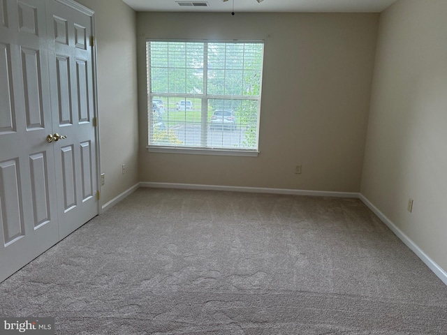 11002 Koman Cir, Manassas, VA 20109 - unfurnished bedroom featuring carpet flooring and baseboards