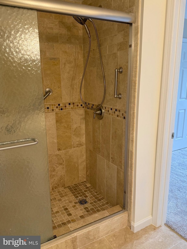 11002 Koman Cir, Manassas, VA 20109 - full bathroom featuring a stall shower and baseboards