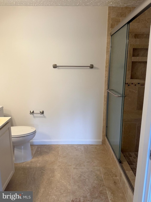 11002 Koman Cir, Manassas, VA 20109 - bathroom featuring vanity, a shower stall, toilet, and baseboards