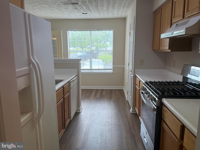 11002 Koman Cir, Manassas, VA 20109 - kitchen featuring white appliances, under cabinet range hood, brown cabinetry, dark wood finished floors, and light countertops