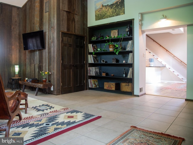 5607 Meridian Rd, Gibsonia, PA 15044 - sitting room featuring wood walls, tile patterned flooring, built in features, and stairs
