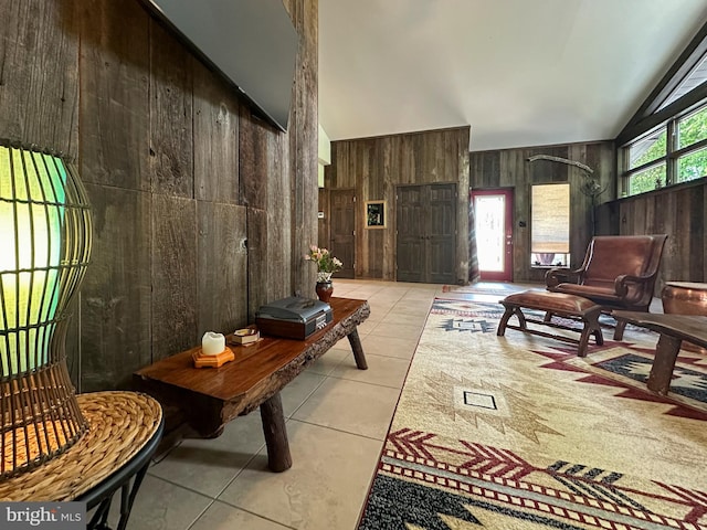 5607 Meridian Rd, Gibsonia, PA 15044 - living area featuring wooden walls, high vaulted ceiling, and light tile patterned floors