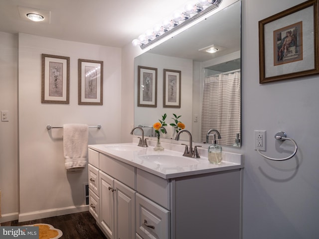 5607 Meridian Rd, Gibsonia, PA 15044 - bathroom featuring double vanity and wood finished floors
