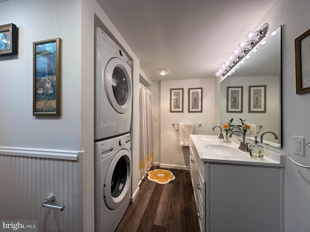 5607 Meridian Rd, Gibsonia, PA 15044 - laundry area featuring stacked washer and clothes dryer and dark wood-style floors