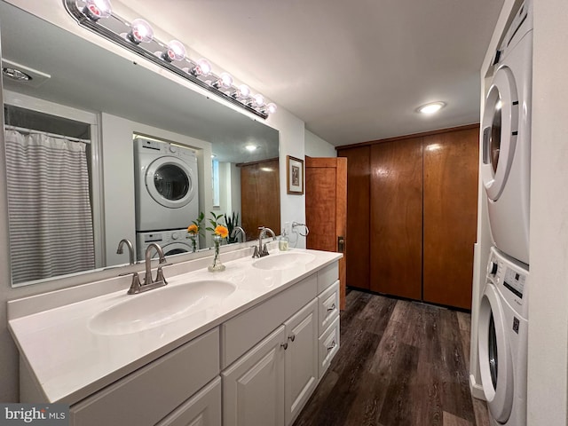 5607 Meridian Rd, Gibsonia, PA 15044 - bathroom with estacked washer and dryer, double vanity, wood finished floors, and recessed lighting