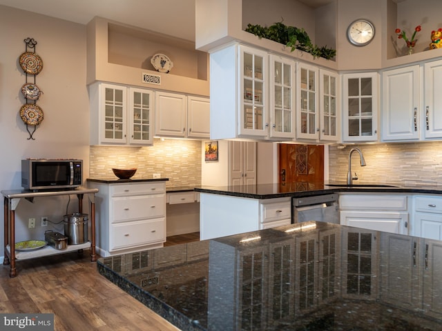 5607 Meridian Rd, Gibsonia, PA 15044 - kitchen featuring stainless steel appliances, white cabinetry, dark wood-style flooring, and tasteful backsplash