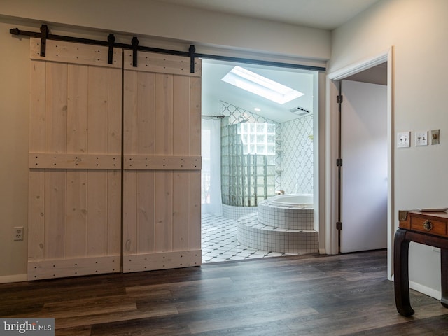 5607 Meridian Rd, Gibsonia, PA 15044 - hallway featuring dark wood-style floors, a skylight, and a barn door