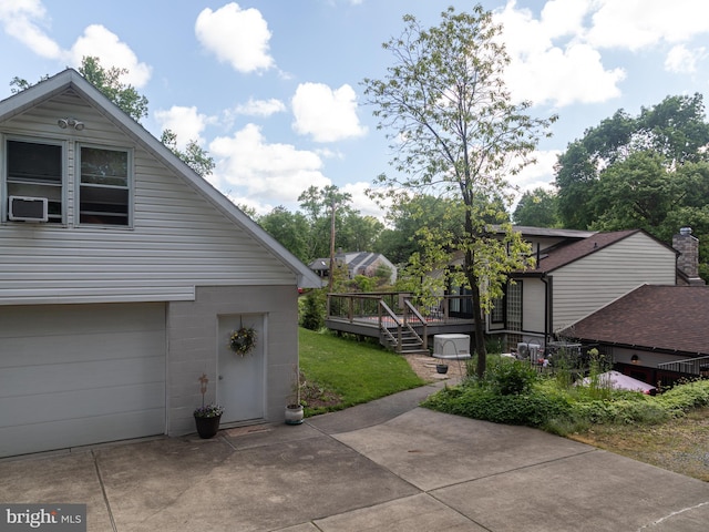 5607 Meridian Rd, Gibsonia, PA 15044 - view of property exterior featuring a wooden deck, a garage, and driveway