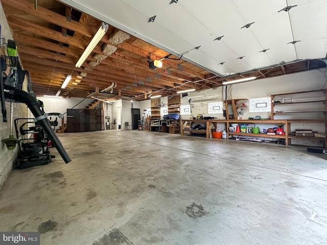 5607 Meridian Rd, Gibsonia, PA 15044 - garage with a garage door opener and a workshop area