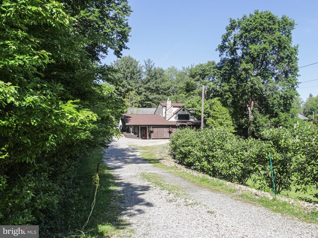 5607 Meridian Rd, Gibsonia, PA 15044 - view of front of home with gravel driveway and a chimney