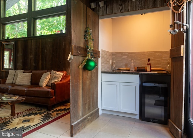 5607 Meridian Rd, Gibsonia, PA 15044 - indoor wet bar featuring beverage cooler, healthy amount of natural light, light tile patterned flooring, and backsplash