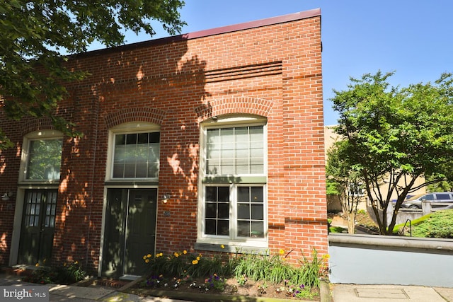 view of front of house featuring brick siding