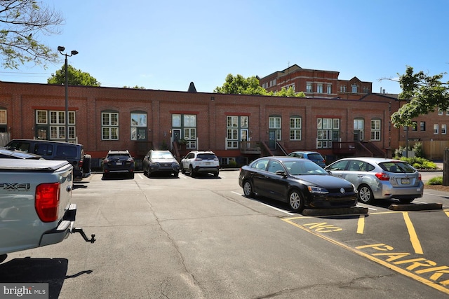 view of property with uncovered parking