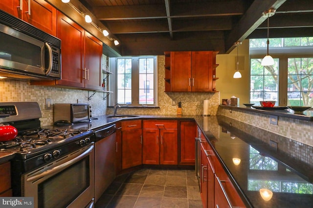 kitchen with stainless steel gas stove, dishwashing machine, a sink, beamed ceiling, and backsplash