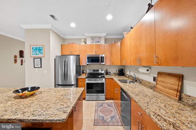 2007 Clipper Park Rd Unit 114, Baltimore, MD 21211 - kitchen with appliances with stainless steel finishes, a sink, crown molding, light stone countertops, and light tile patterned floors