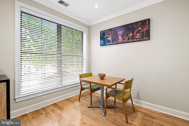 2007 Clipper Park Rd Unit 114, Baltimore, MD 21211 - dining space featuring baseboards, ornamental molding, and light wood-style floors