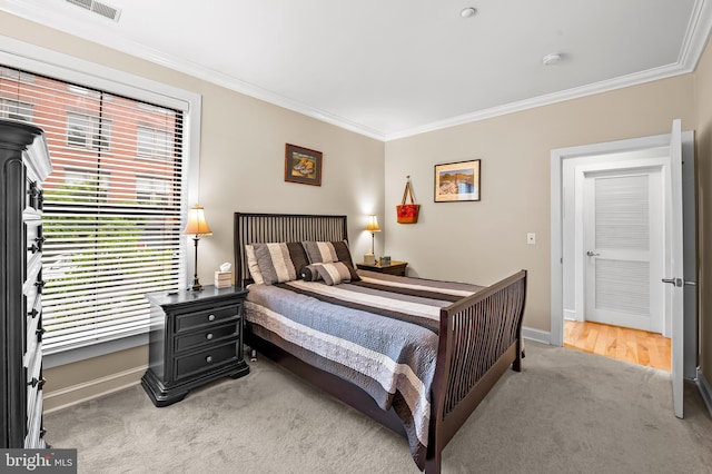 2007 Clipper Park Rd Unit 114, Baltimore, MD 21211 - bedroom featuring ornamental molding, light colored carpet, and baseboards