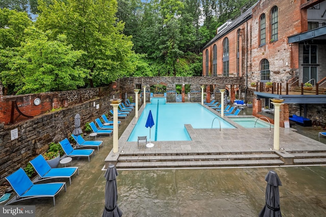 2007 Clipper Park Rd Unit 114, Baltimore, MD 21211 - community pool with a patio and view of scattered trees