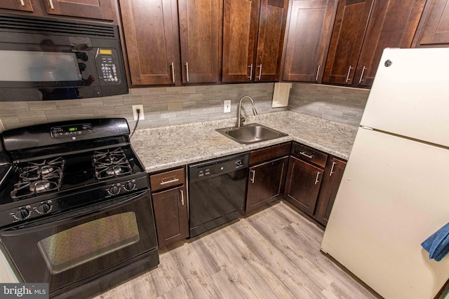 5 Canterbury Sq Unit 201, Alexandria, VA 22304 - kitchen featuring black appliances, a sink, dark brown cabinets, and decorative backsplash