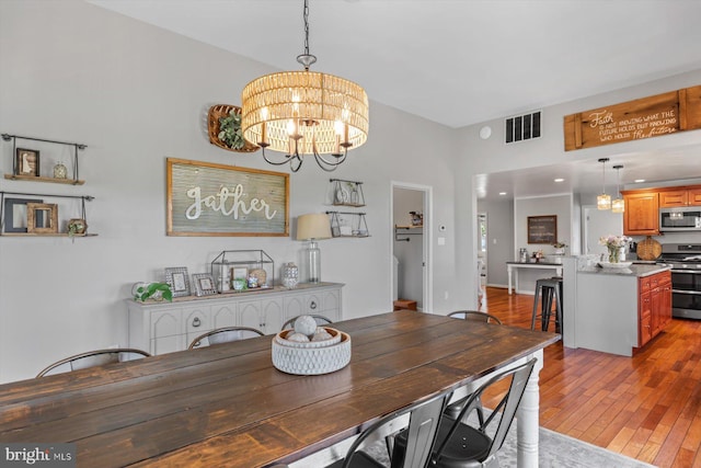34602 Roxana Rd, Frankford, DE 19945 - dining room with light wood-style floors and a chandelier