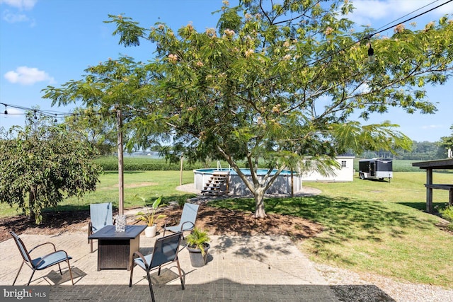 34602 Roxana Rd, Frankford, DE 19945 - view of patio / terrace with an outdoor pool, an outdoor fire pit, and an outdoor structure