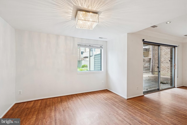 19439 Brassie Pl Unit 101, Gaithersburg, MD 20886 - unfurnished room featuring wood finished floors, baseboards, and crown molding
