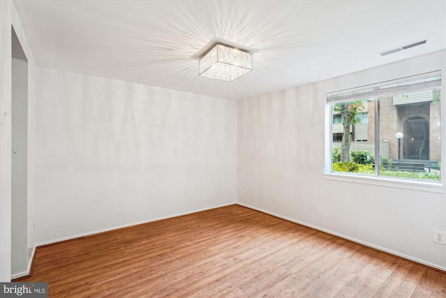 19439 Brassie Pl Unit 101, Gaithersburg, MD 20886 - spare room featuring wood finished floors and baseboards