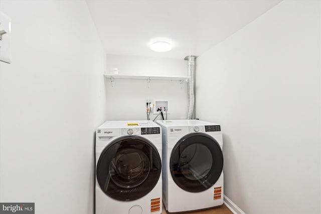19439 Brassie Pl Unit 101, Gaithersburg, MD 20886 - laundry area with independent washer and dryer and baseboards
