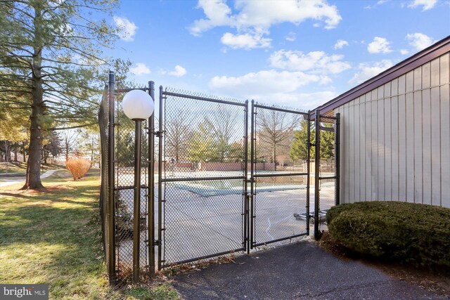 19439 Brassie Pl Unit 101, Gaithersburg, MD 20886 - view of tennis court with a gate