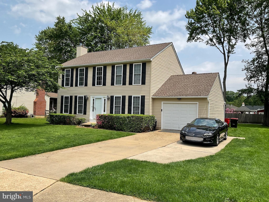 1345 Sweetbriar Ln, Bel Air, MD 21014 - colonial house with a garage, concrete driveway, a chimney, and roof with shingles