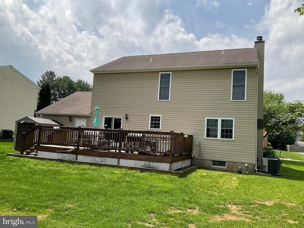1345 Sweetbriar Ln, Bel Air, MD 21014 - rear view of house featuring central air condition unit, a chimney, a wooden deck, and a yard